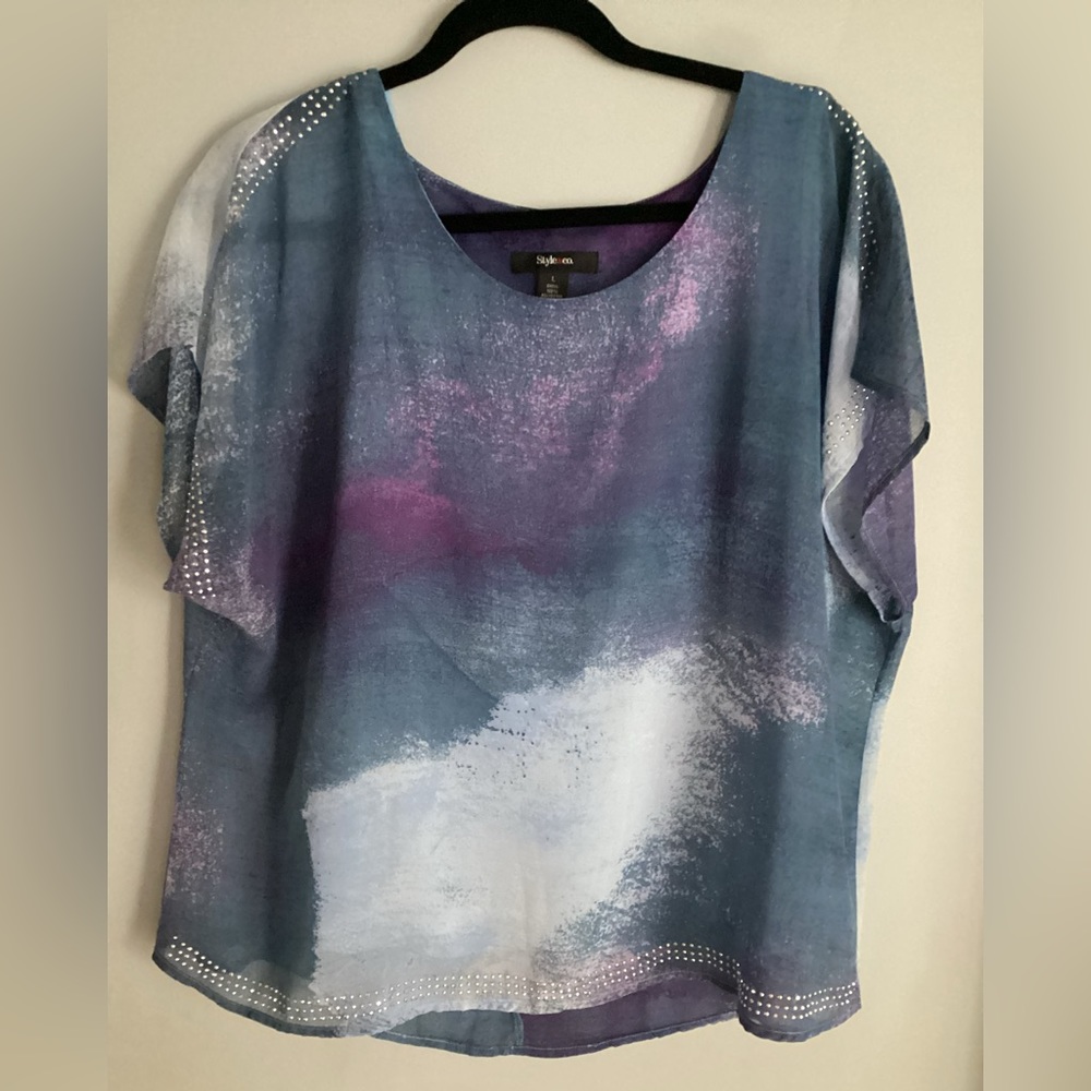 Womens layered top with rhinestone embellishments.